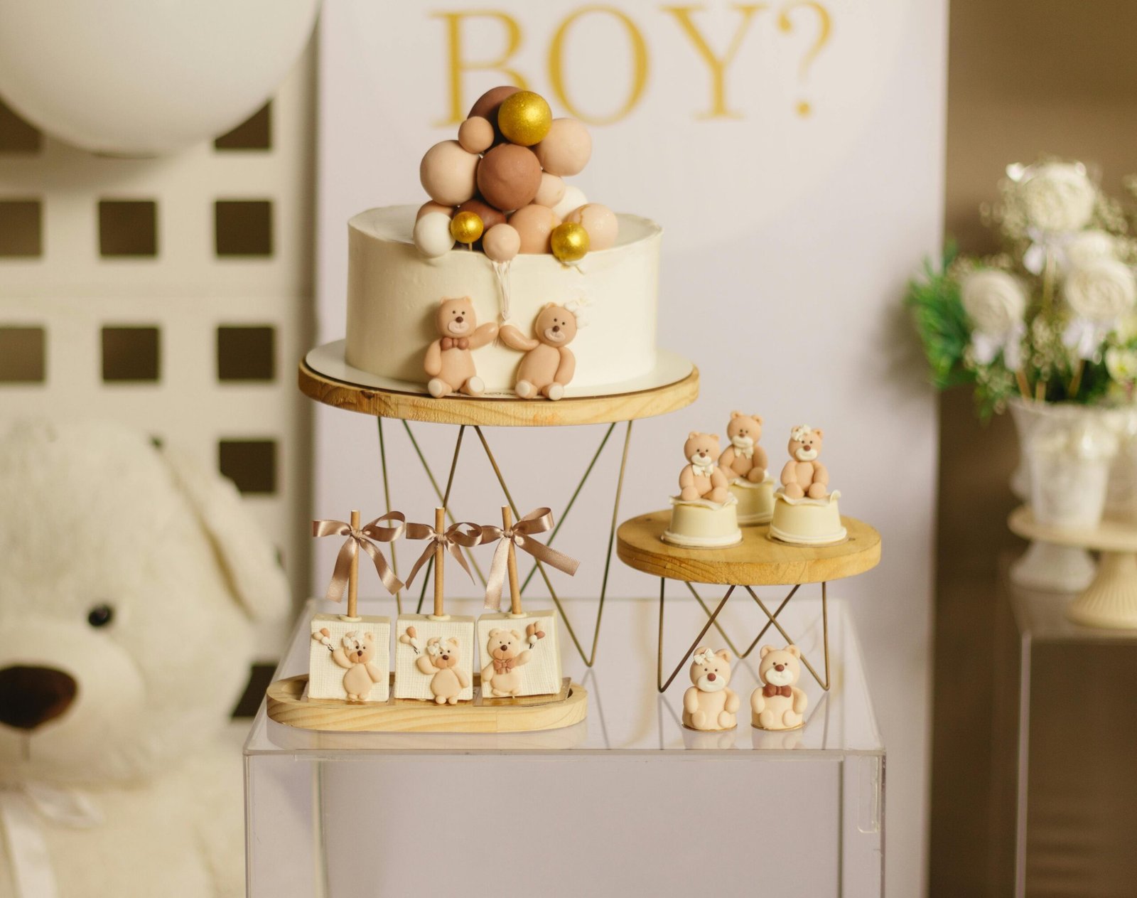 Delightful baby shower cake with teddy bear toppers and elegant decoration for a baby boy theme.